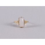 A 14 kt 585/1000 gold Art Deco ring with a facet cut light gray stone. Ring size 18.5 mm.