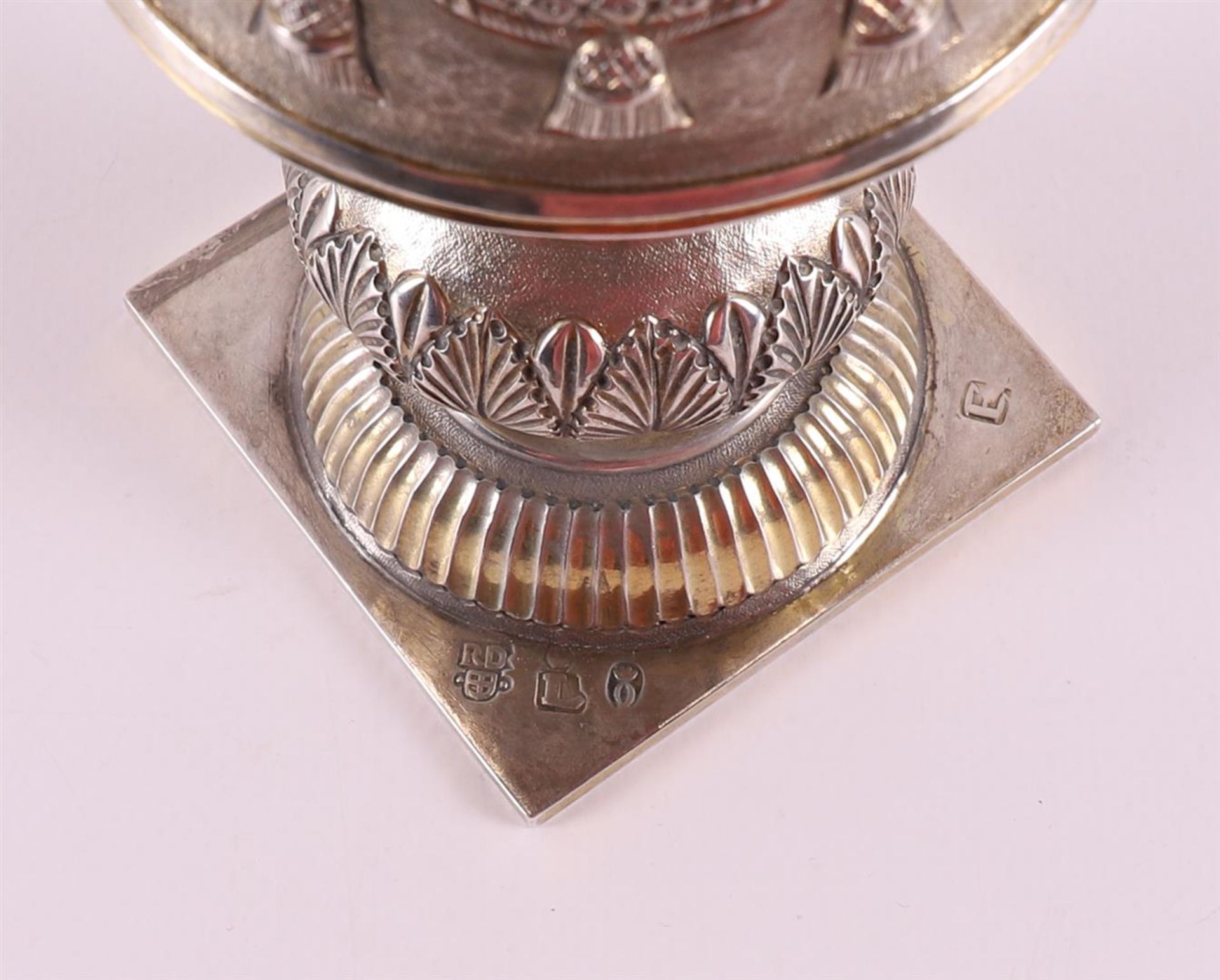 A silver sugar shaker, after an 18th century example, 19th century or later. Driven decoration of, - Image 7 of 7