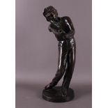 A brown patinated bronze sculpture of a golfer, 20th/21st century