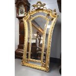 A Louis XV style gilt framed mirror, after an antique example
