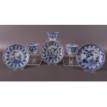 Three blue and white porcelain cups and saucers, China, Kangxi, around 1700.