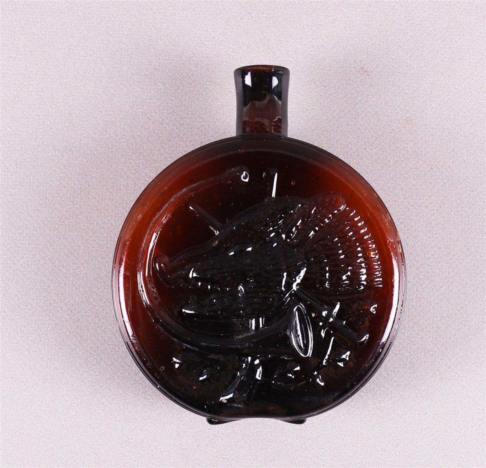 A red pressed glass vial, Bohemia, around 1800.