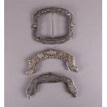 Two 2nd grade 835/1000 silver purse brackets and a shoe buckle, 19th century