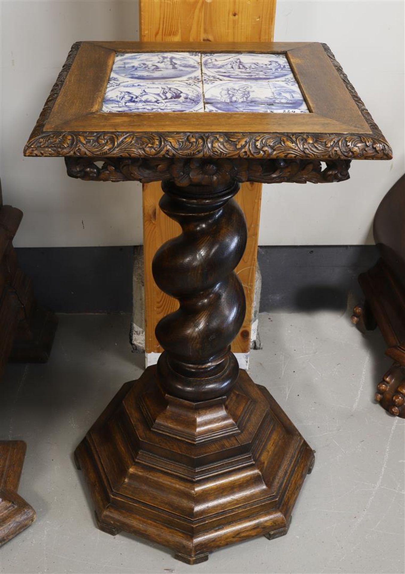 An oak side table with 18th century blue and white tiles as a top, 19th century