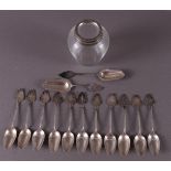 A series of twelve silver teaspoons and tea spoon, 20th century.