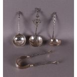 A lot of second grade silver cream spoons and sugar tongs, 20th century.
