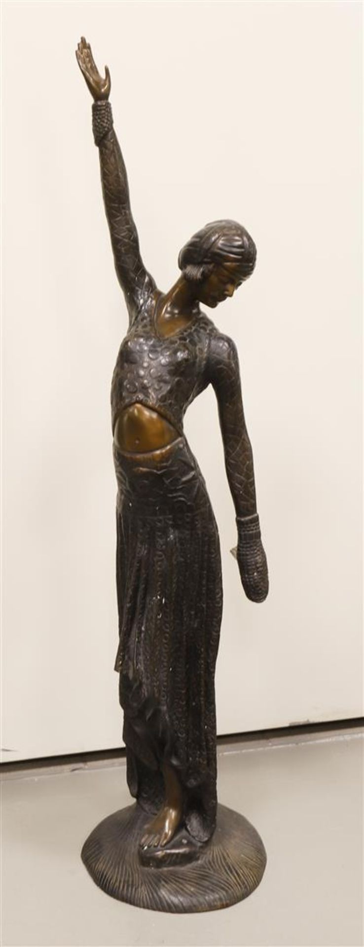 A brown patinated bronze 'Alexandrian' dancer, Art Deco style, after Chipa