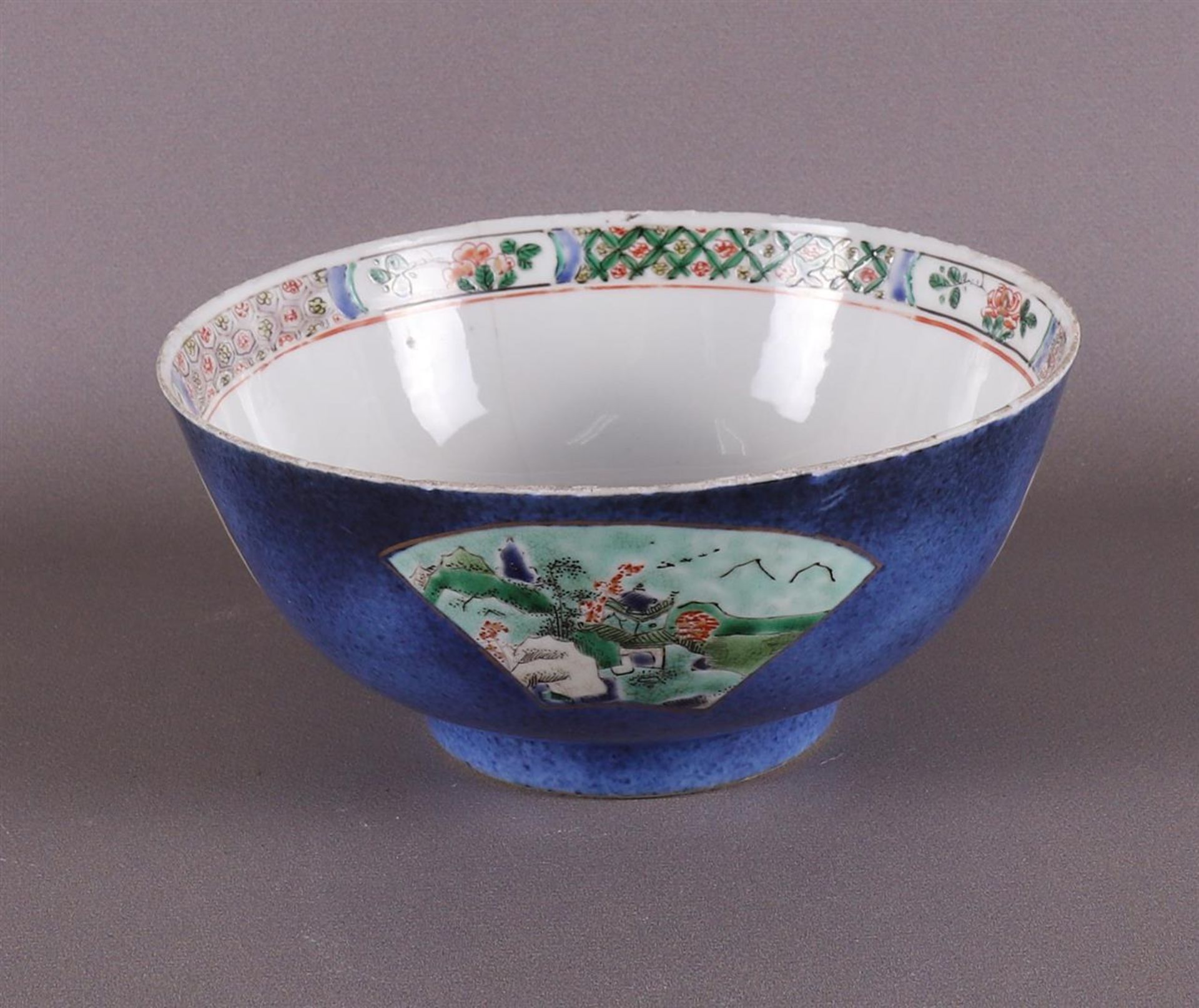 A porcelain famille verte bowl with 'poudre bleu' ground, China, Kangxi, ca 1700