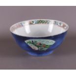 A porcelain famille verte bowl with 'poudre bleu' ground, China, Kangxi, ca 1700