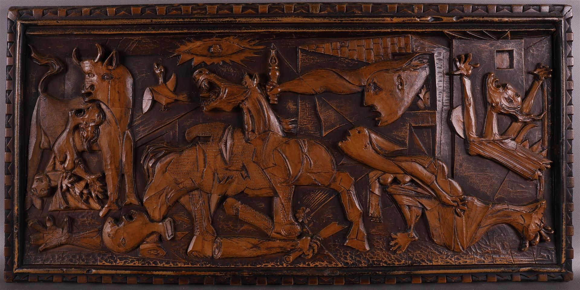A carved wooden panel 'Guernica', after Pablo Picasso, 2nd half 20th century