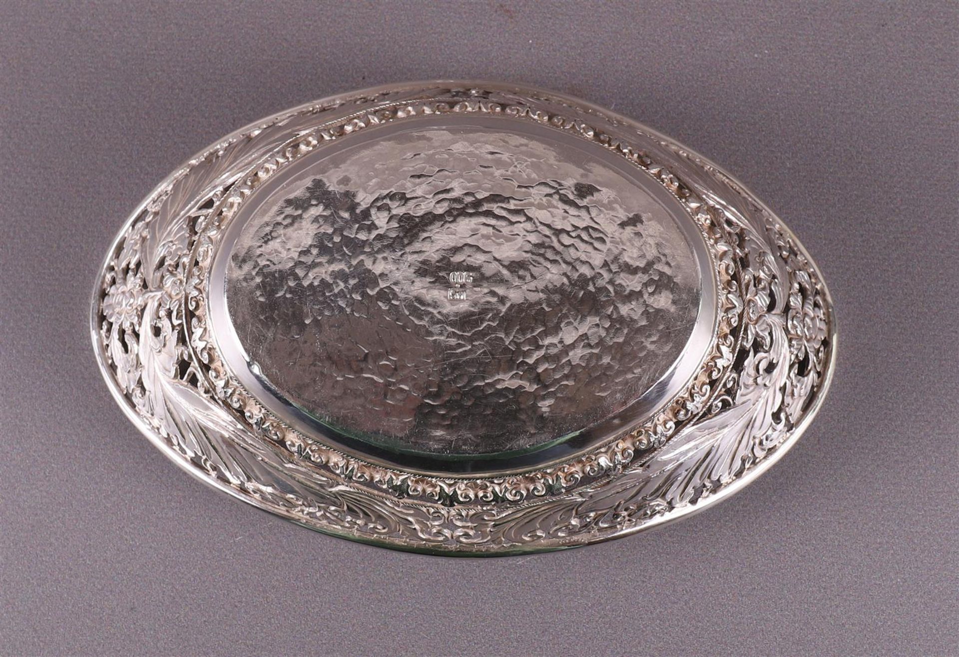 A silver oval pierced bonbonière with floral decor, Indonesia - Image 5 of 5