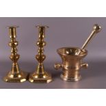 A pair of brass one-light candlesticks, 19th century.