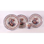 Three porcelain Imari plates with pierced lips, Japan, Meiji, late 19th century