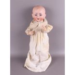 A limbed doll with porcelain head, Germany, circa 1910.