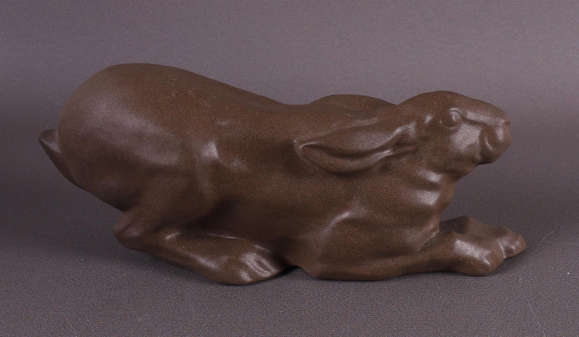 A brown stoneware reclining rabbit, Gien, France. - Image 3 of 4