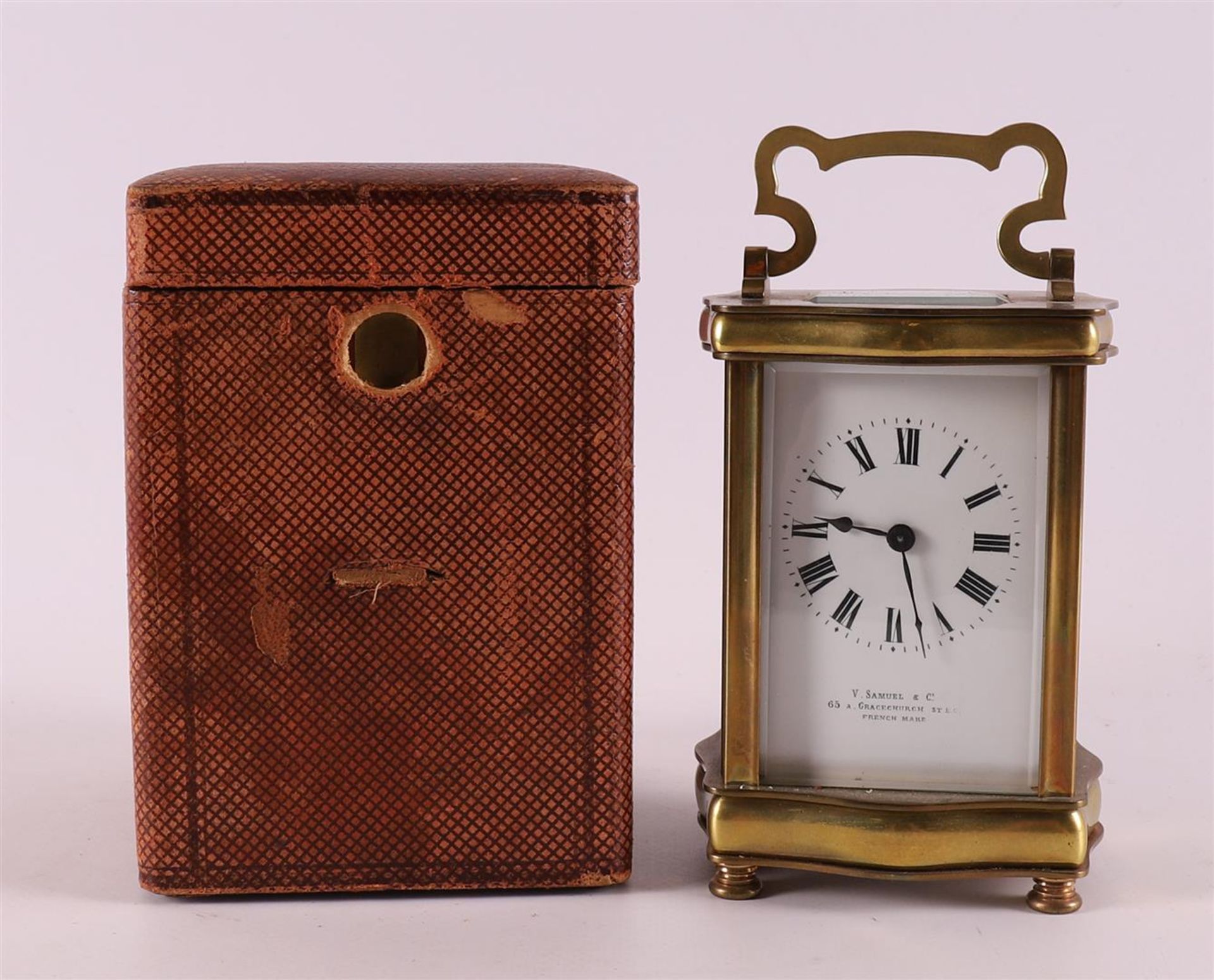 A travel clock in brass housing and original case, France,
