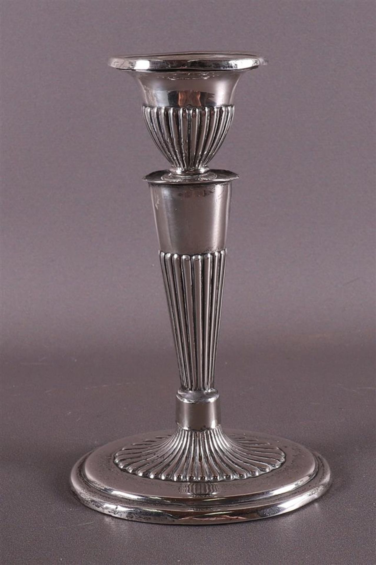 A second grade silver one-light candlestick in Empire style, 20th century.