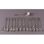 A set of twelve silver teaspoons and sugar scoop, ca. 1930.