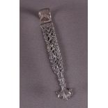 A pierced 2nd grade silver candy tongs with hammered decor.