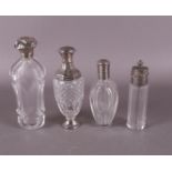 Four clear crystal fragrance flasks with silver valve cap and frame, 19th centur
