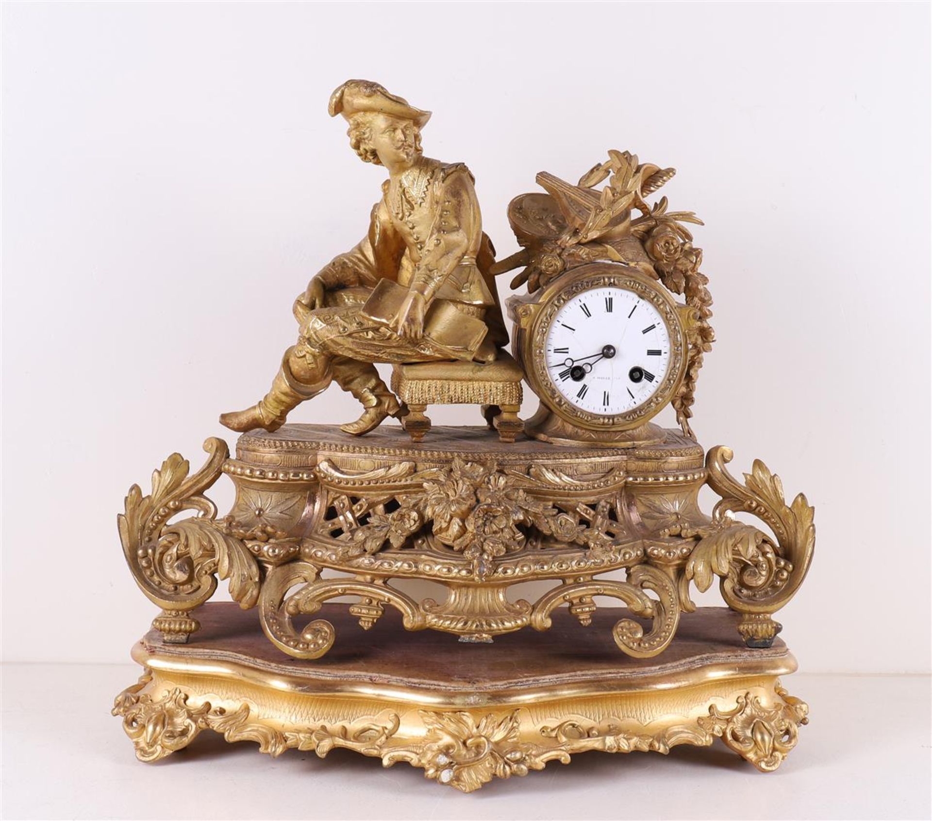 A gilded mantel clock on loose wooden base, France, 2nd half of the 19th century