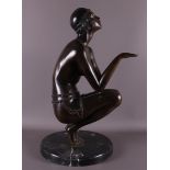 A brown patinated bronze crouching dancer, Art Deco style, 20th century