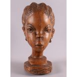 A tropical wooden bust of a woman, Africa, Ivory Coast or surroundings