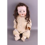 A limbed doll with a porcelain head, Germany, ca. 1910.