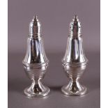 A set of 1st grade silver baluster-shaped salt and pepper shakers.