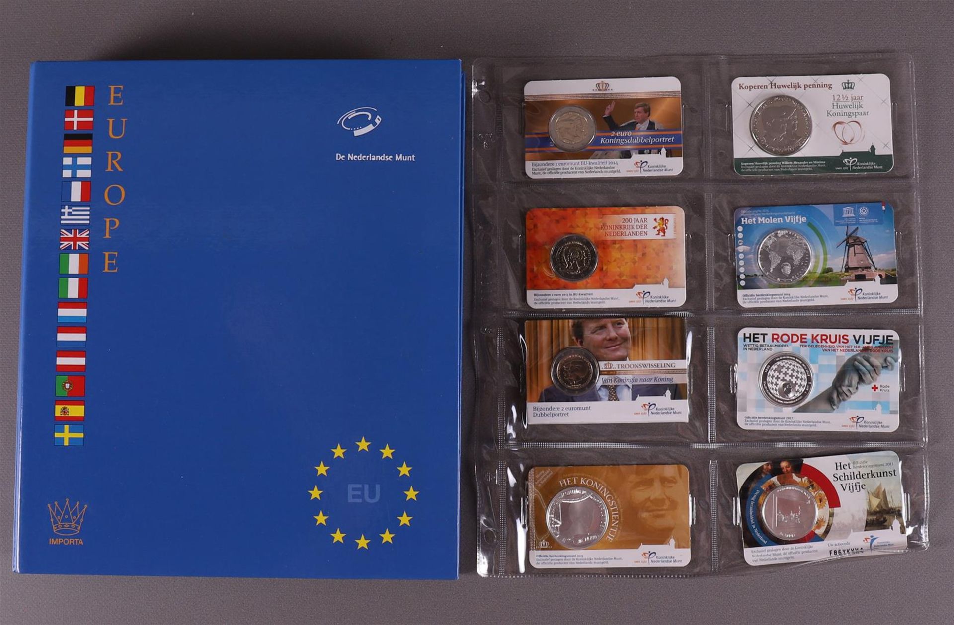 An album containing European coin cards.