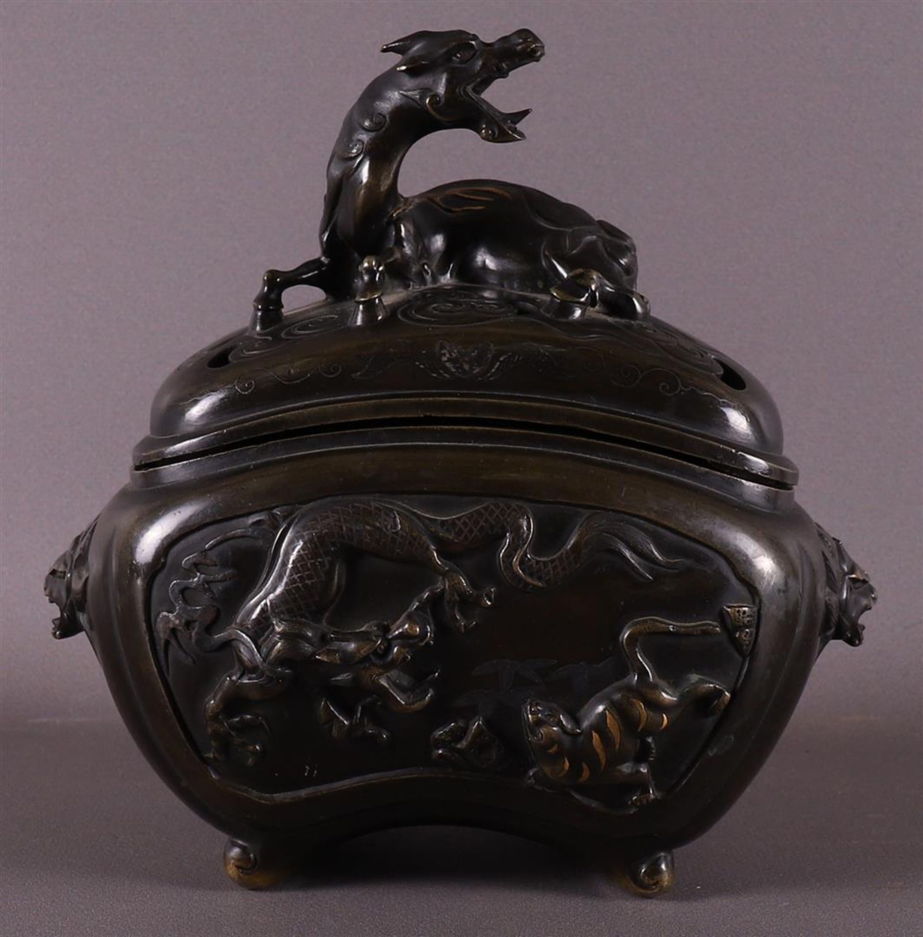 A brown patinated koro with dragon heads for ears, China, 2nd half 19th century.