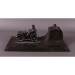A white metal Art Nouveau inkwell with a car as an application, around 1900.