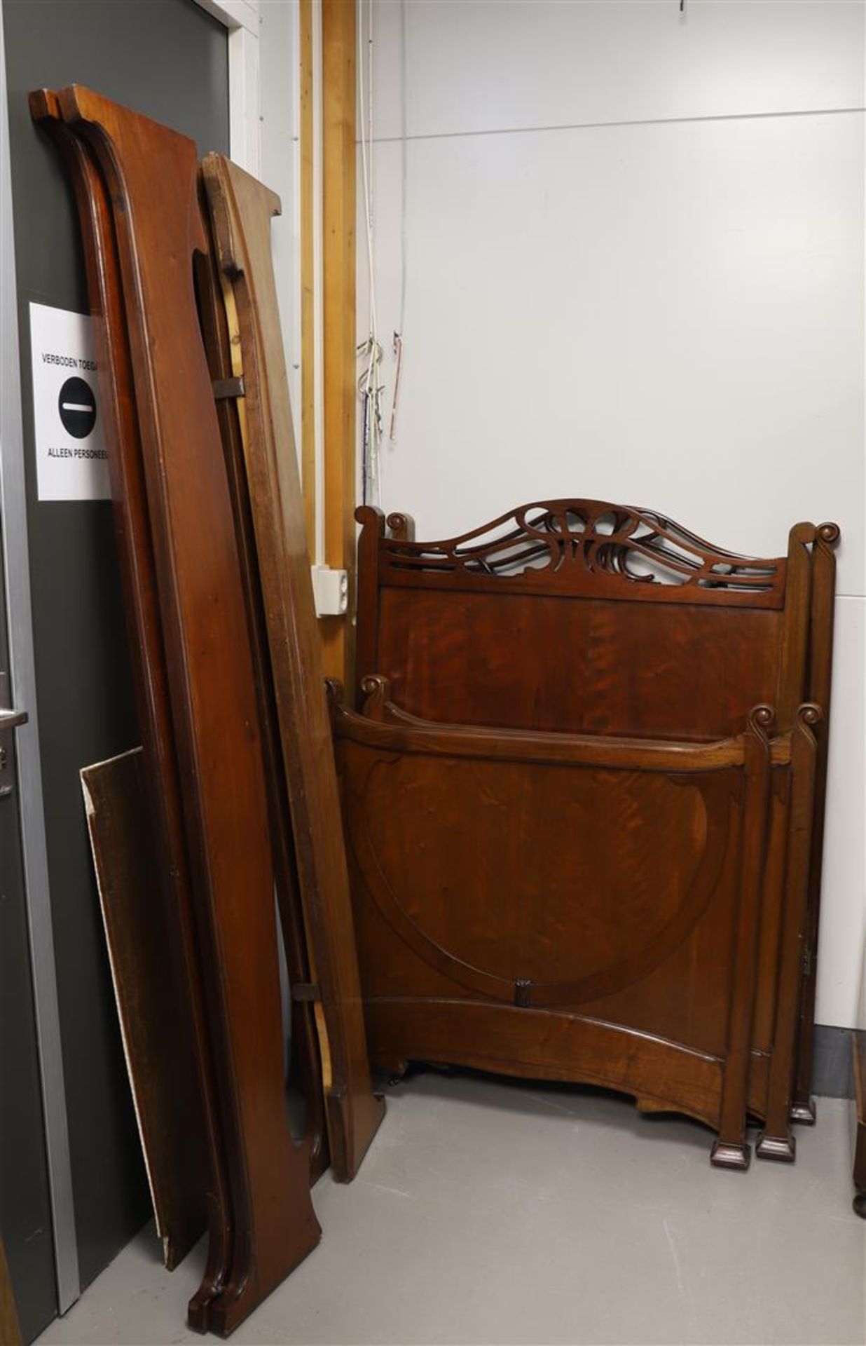 A mahogany Art Nouveau twin bed, circa 1900.