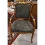 A walnut arm chair with green fabric upholstery, 20th century.