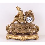 A gilded mantel clock on loose wooden base, France, 2nd half of the 19th century. The movement
