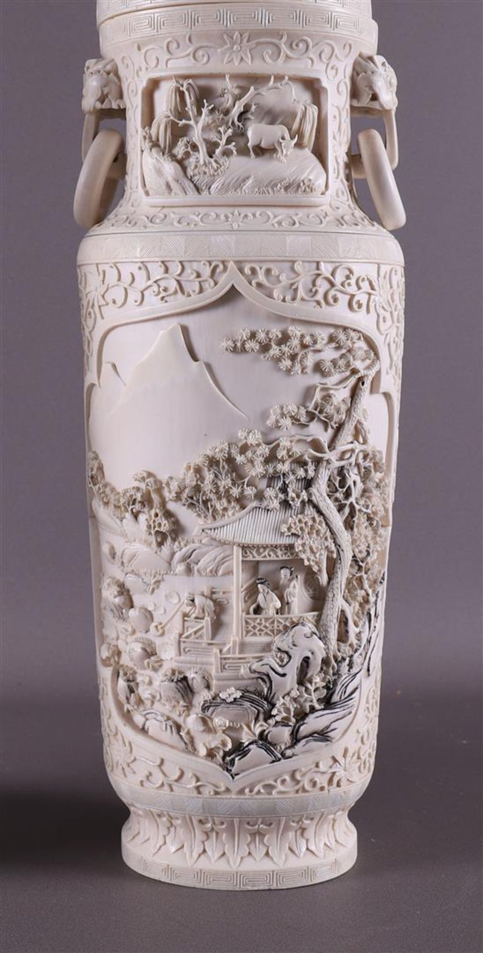 A pair of carved ivory baluster-shaped lidded vases with ringed lion heads as ears, China, Qing - Image 14 of 28