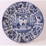 A blue/white Delft earthenware dish, Holland, 18th/19th century. Blue underglaze 'Wanli' cracked