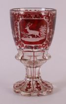 A clear and red glass glass, Bohemia, 2nd half of the 19th century. Cut decor of red deer in