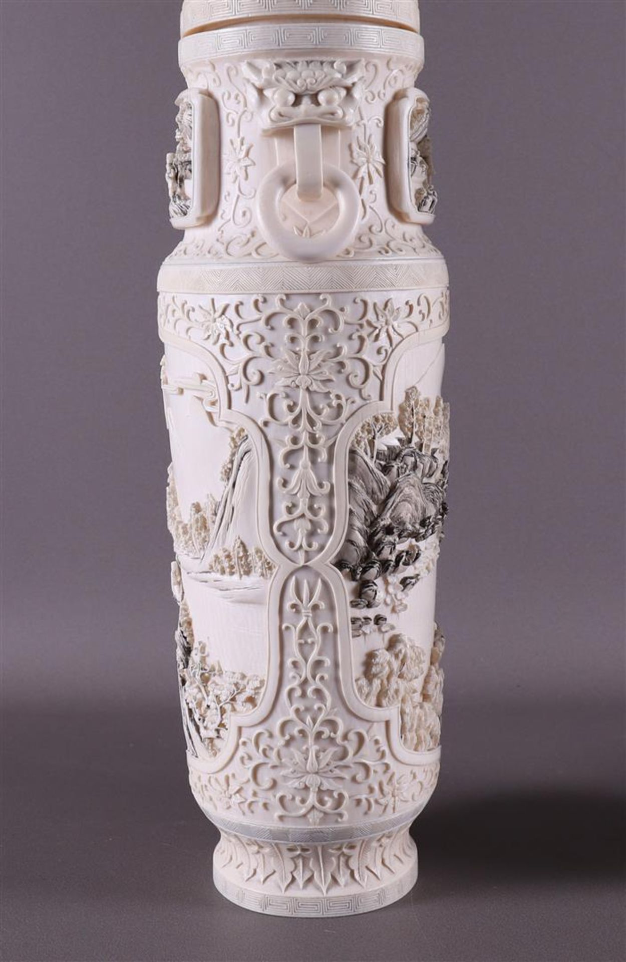 A pair of carved ivory baluster-shaped lidded vases with ringed lion heads as ears, China, Qing - Image 7 of 28