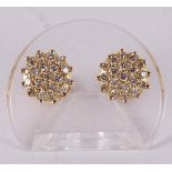 A pair of 18 kt 750/1000 gold stud earrings with 38 diamonds of a total of 0.80 crt H-SI.