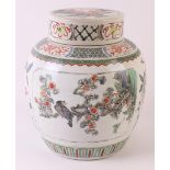 A spherical famille verte ginger jar with lid, China, Kangxi, around 1700. Polychrome decor of carps