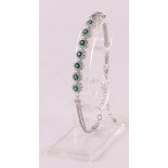 A 1st grade 925/1000 silver bracelet with facet cut green stones and zirconias.