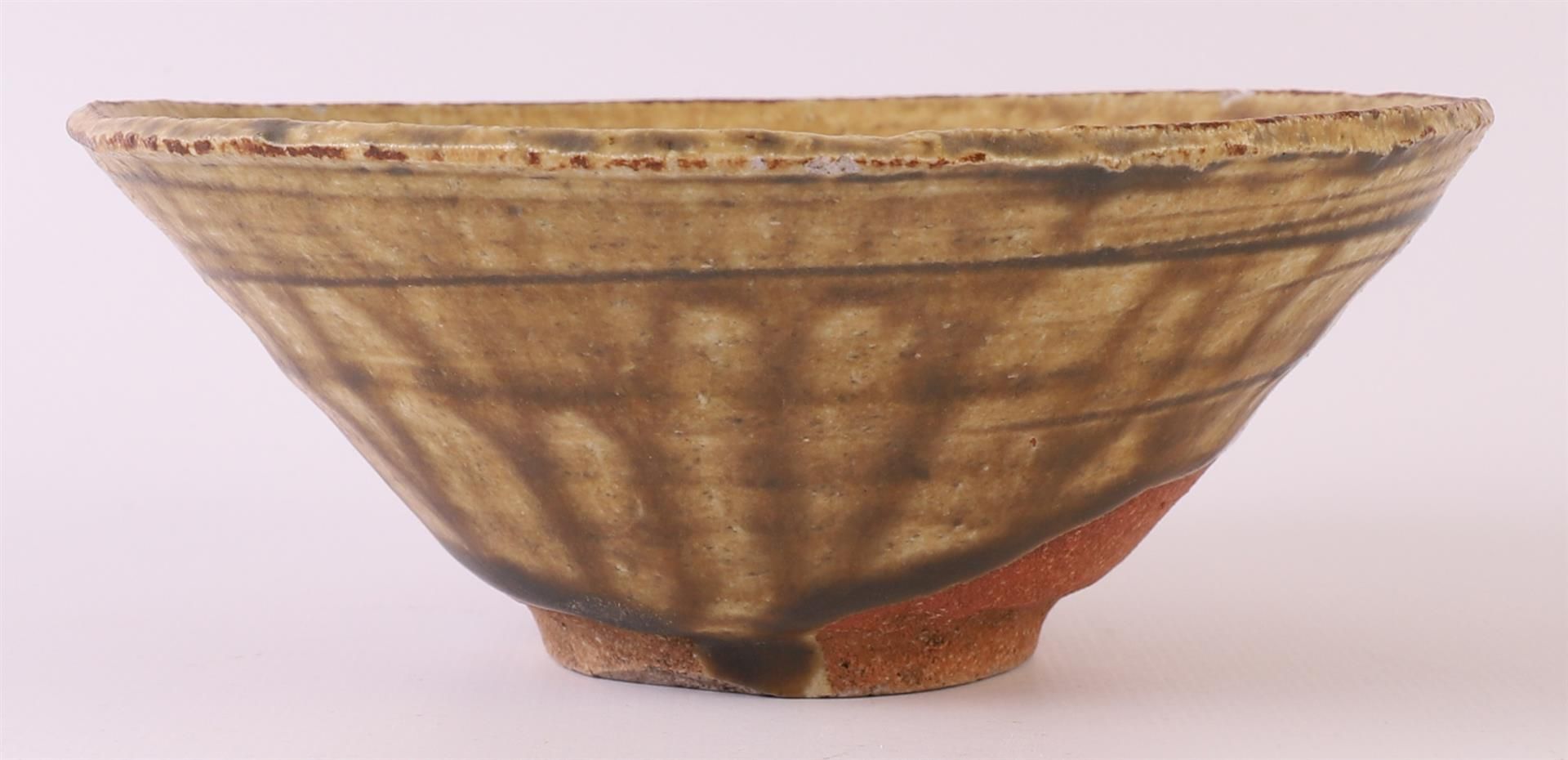 A brown glazed earthenware conical Temmoku bowl, China, Song dynasty 12th century, h 5 x Ø 13.5 - Image 2 of 8