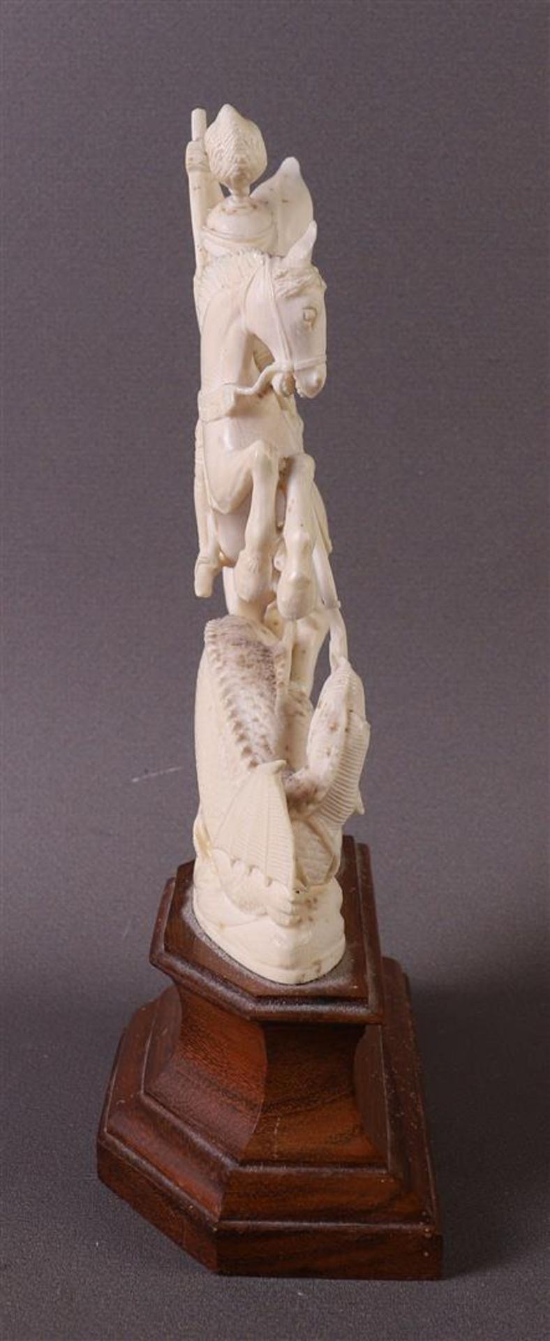 A carved ivory sculpture of Saint St. George and the dragon, depicted on a prancing horse, France, - Image 3 of 5