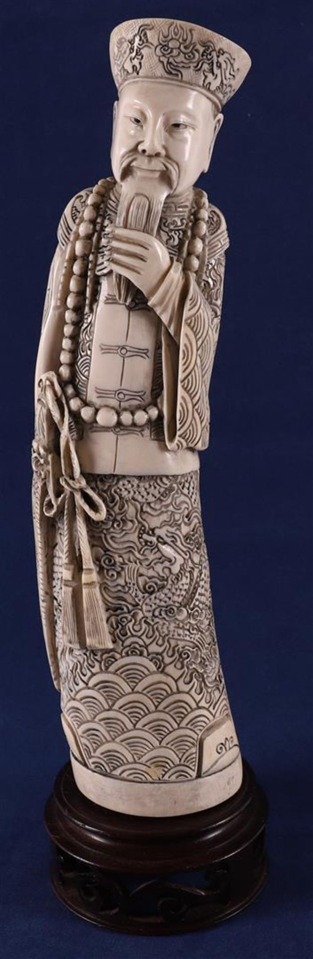 A carved ivory figure of a Mandarin, China, late 19th century. Signed 'Qianlong' bottom, h30 cm, - Image 3 of 14