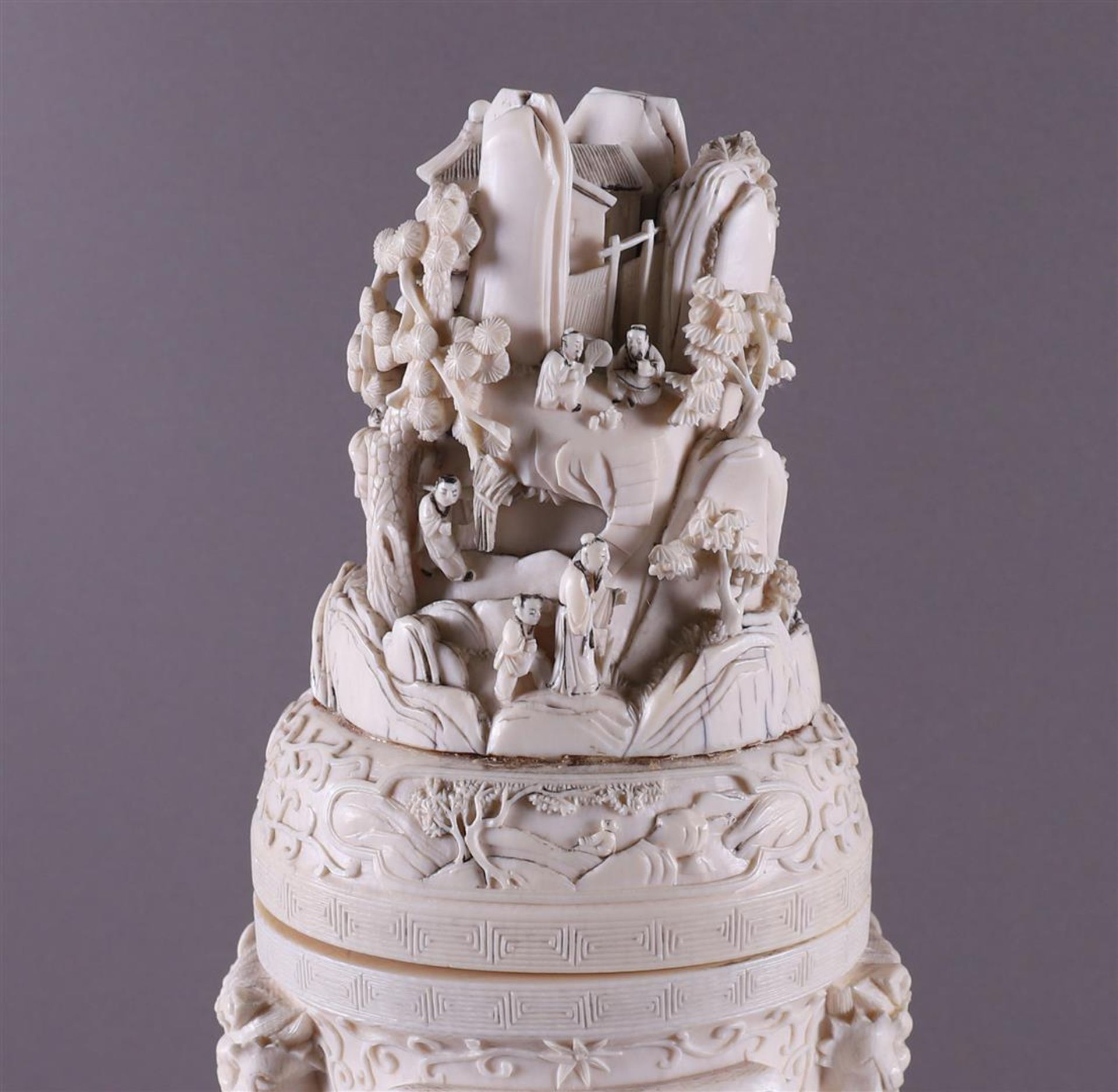 A pair of carved ivory baluster-shaped lidded vases with ringed lion heads as ears, China, Qing - Image 13 of 28