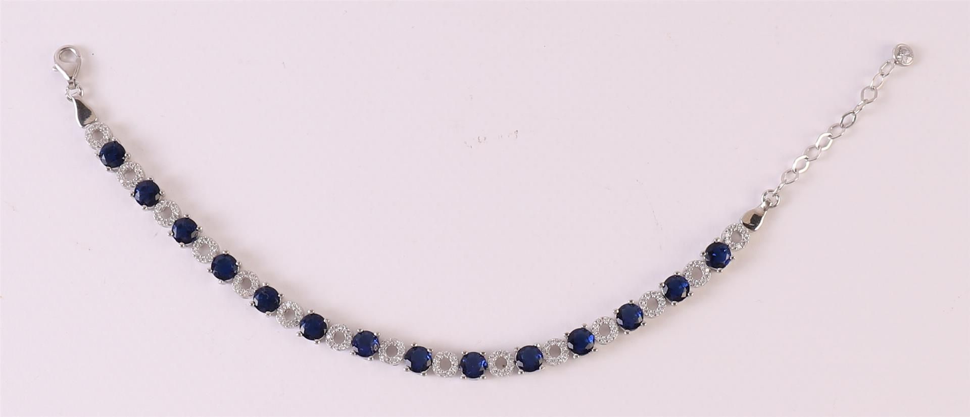 A 1st grade 925/1000 silver tennis bracelet with facet cut blue stones and zirconias. - Image 3 of 3