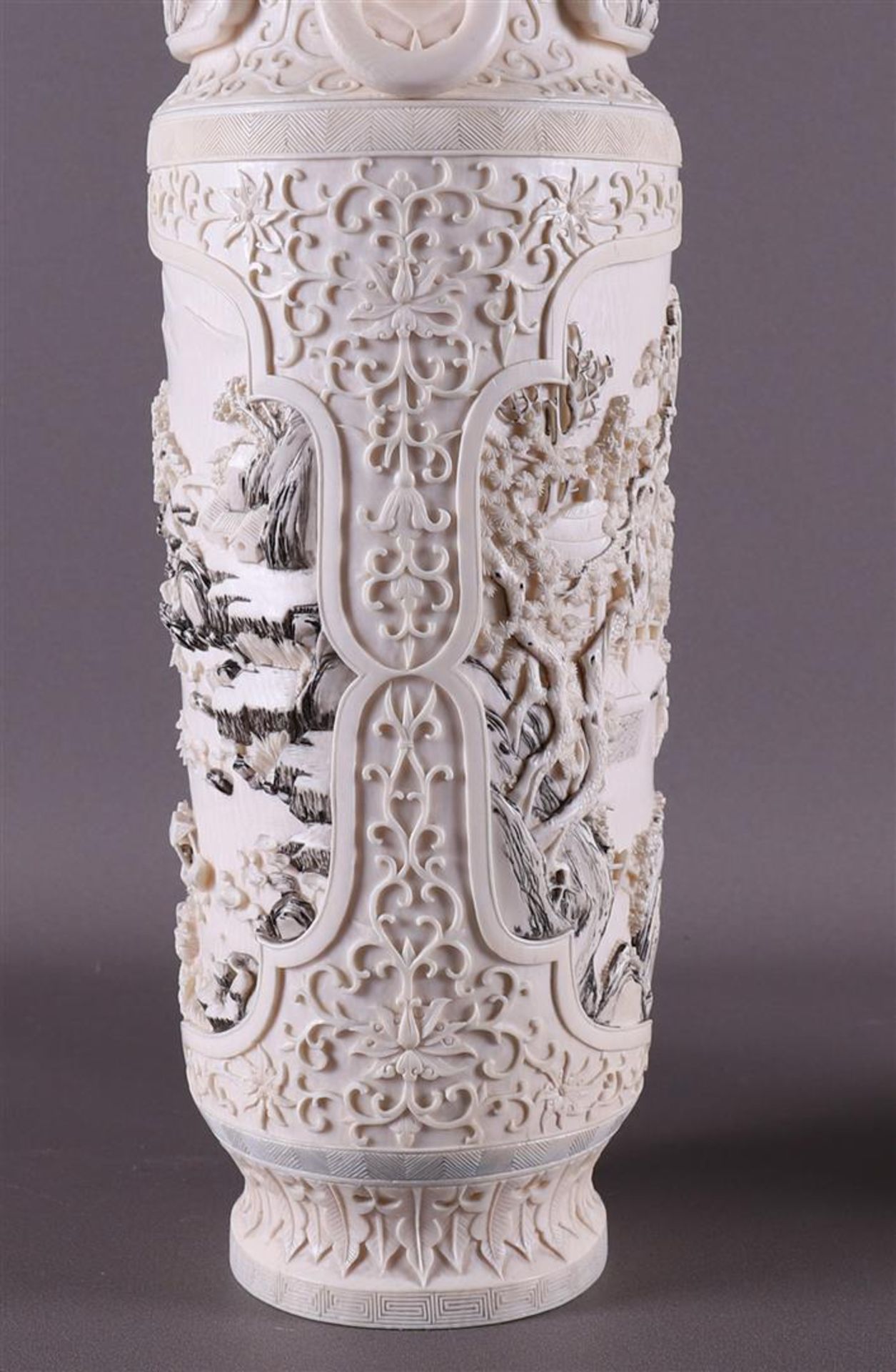 A pair of carved ivory baluster-shaped lidded vases with ringed lion heads as ears, China, Qing - Image 17 of 28