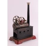 A tin steam engine, 1st half of the 20th century, h 29 x l 20 x w 11.5 cm. .