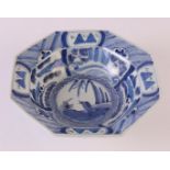 An octagonal blue/white porcelain hooded bowl, China, around 1800. Blue underglaze decor of a crow